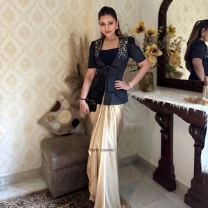 "Black embroidered blazer with golden silk dhoti skirt set, featuring French Crepe Silk and Japanese Satin fabric."