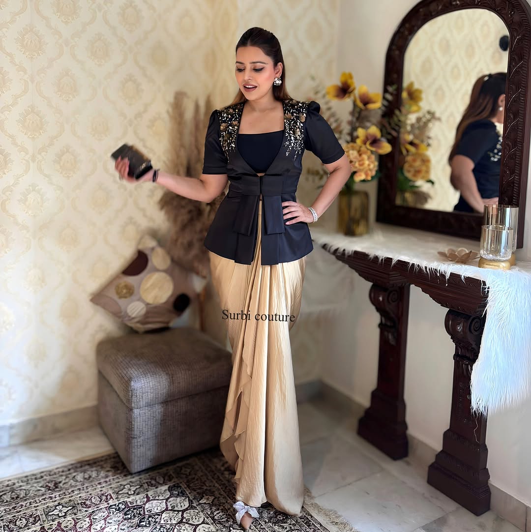 "Elegant full view of Black Embroidered Blazer paired with a golden dhoti skirt, perfect for festive occasions."
